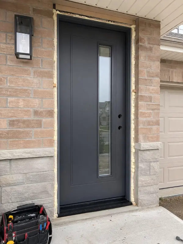 Door replacement being completed on a residential interior or exterior opening.