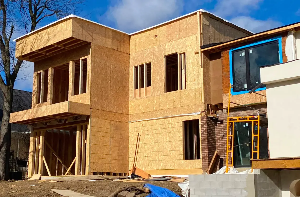 Home extension framing in progress for a larger residential living space.