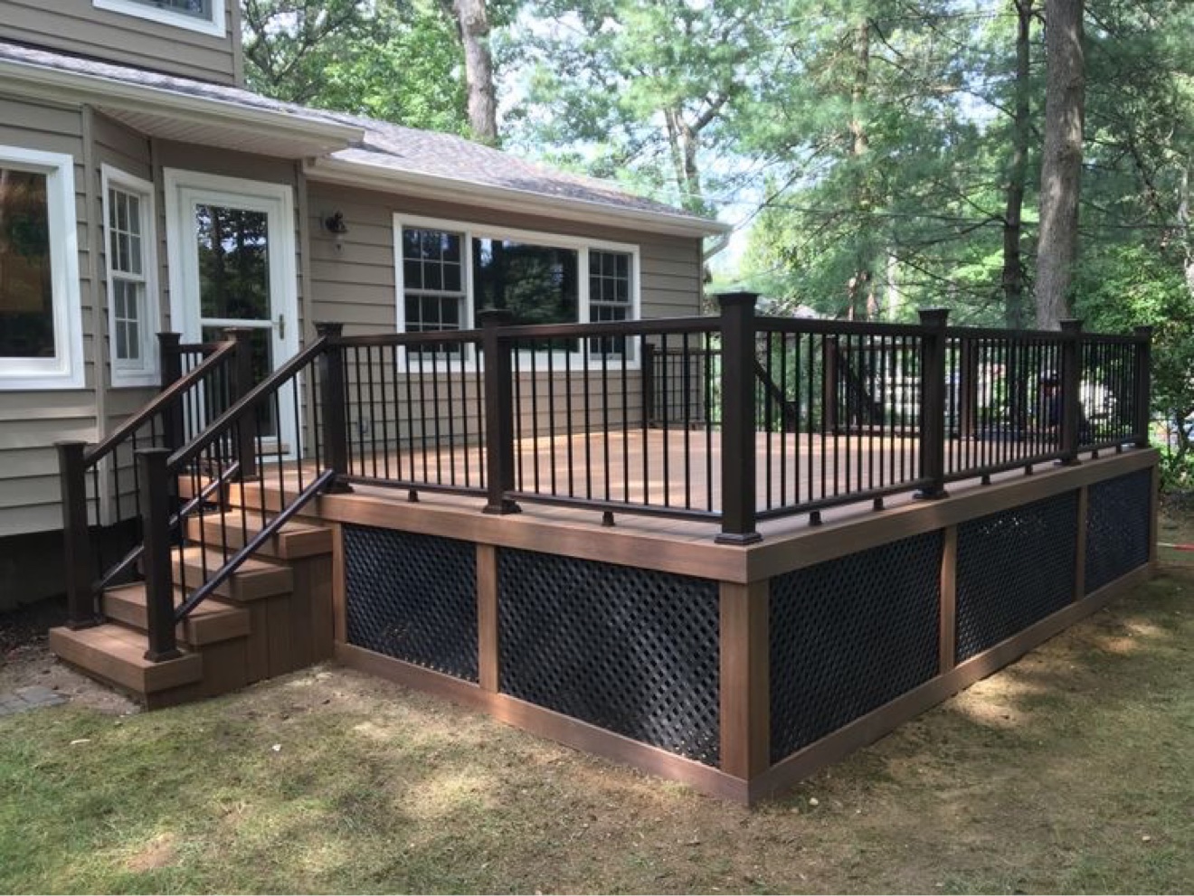 Composite deck with dark railings — Rouge Home Development Inc., GTA