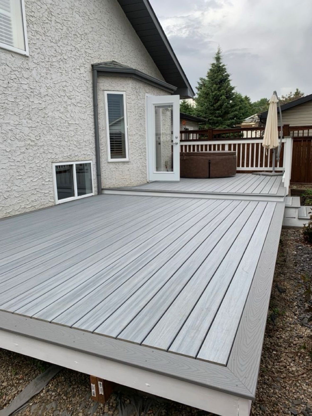 Composite deck built around a hot tub — Rouge Home Development Inc., GTA
