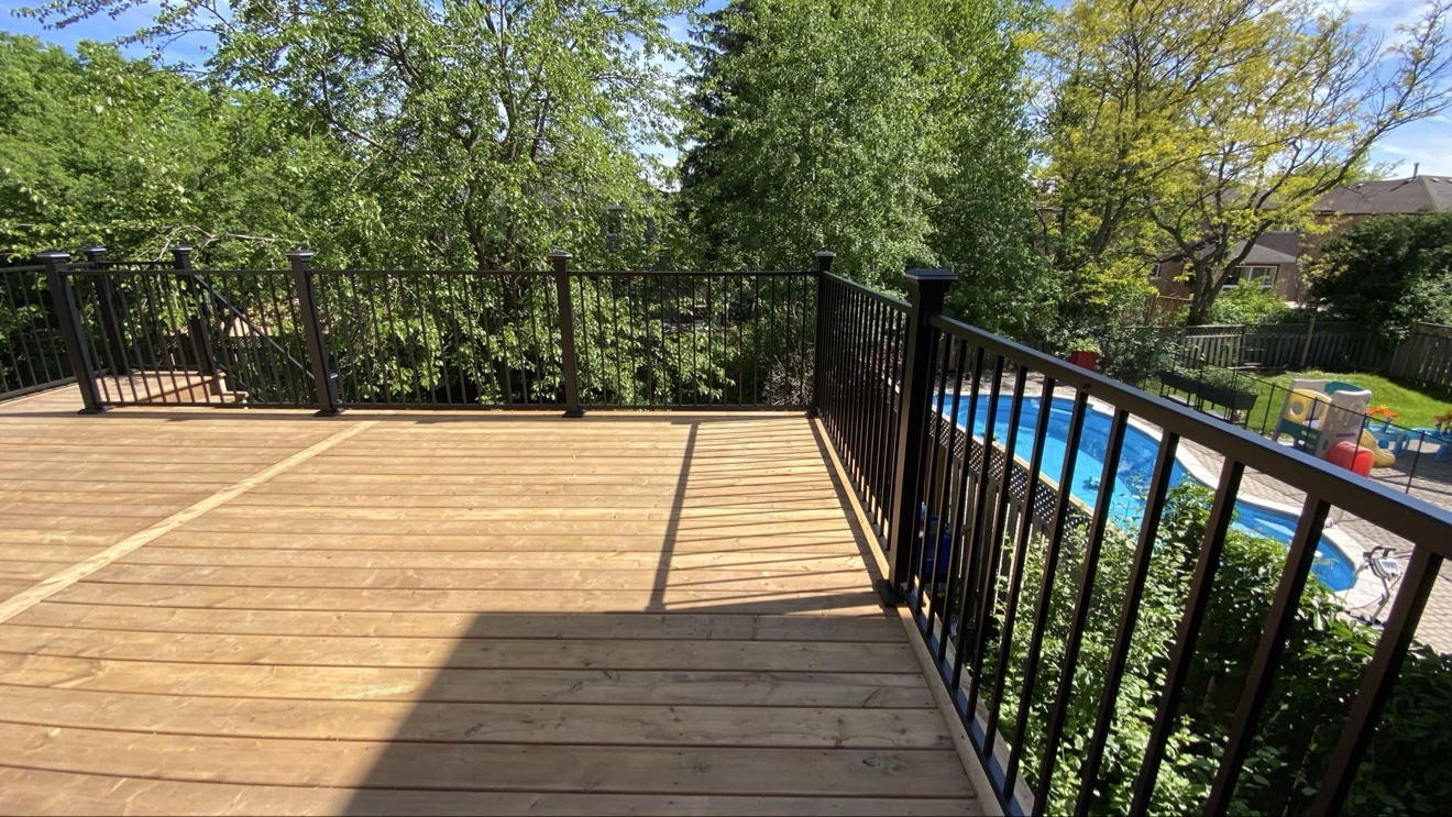 Large deck with black aluminum railings — Rouge Home Development Inc., GTA
