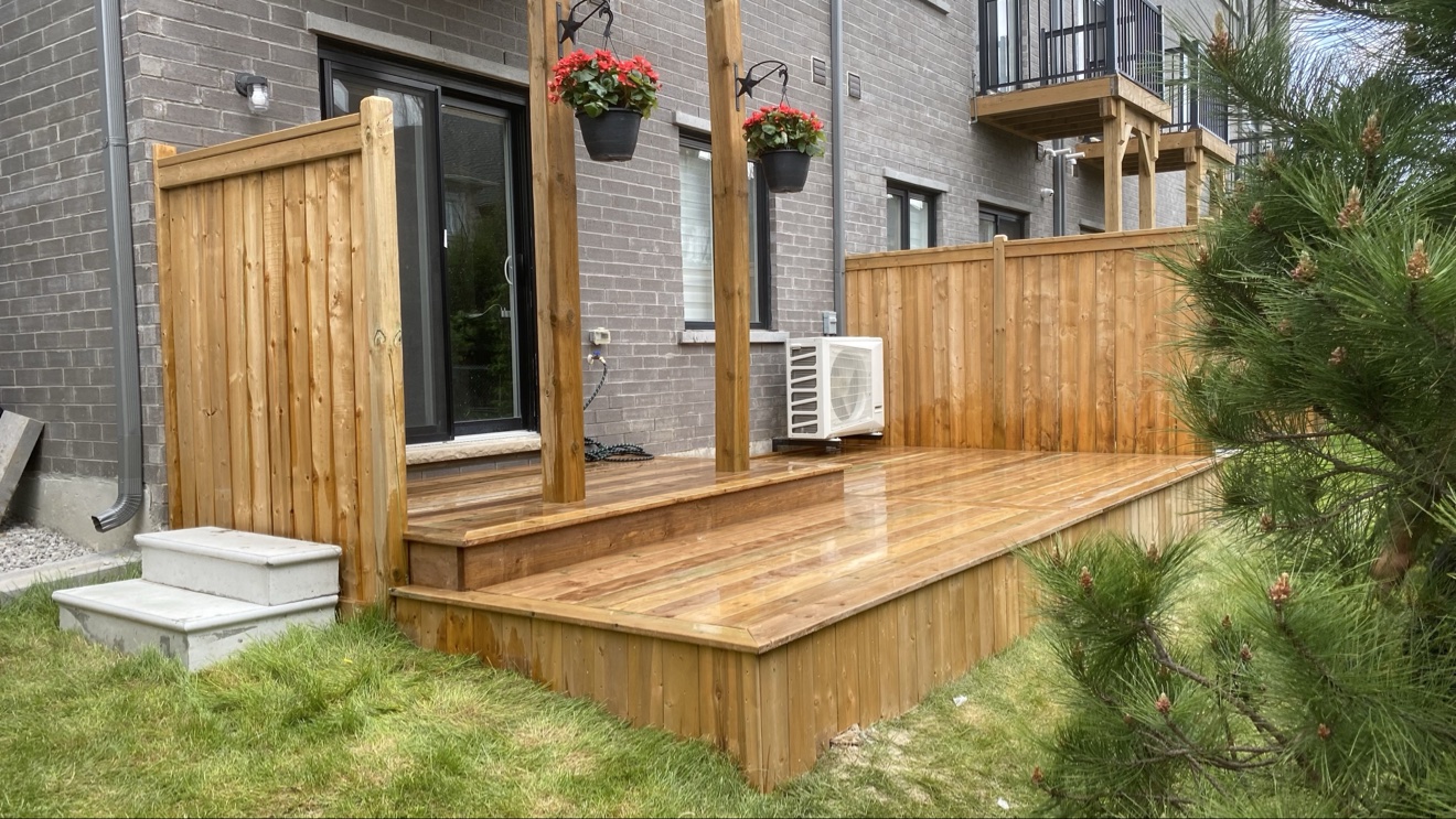 Pressure-treated deck with privacy screen — Rouge Home Development Inc., GTA