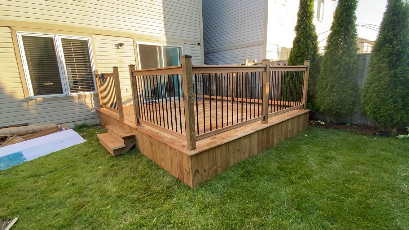 Pressure-treated deck with wood railings — Rouge Home Development Inc., GTA
