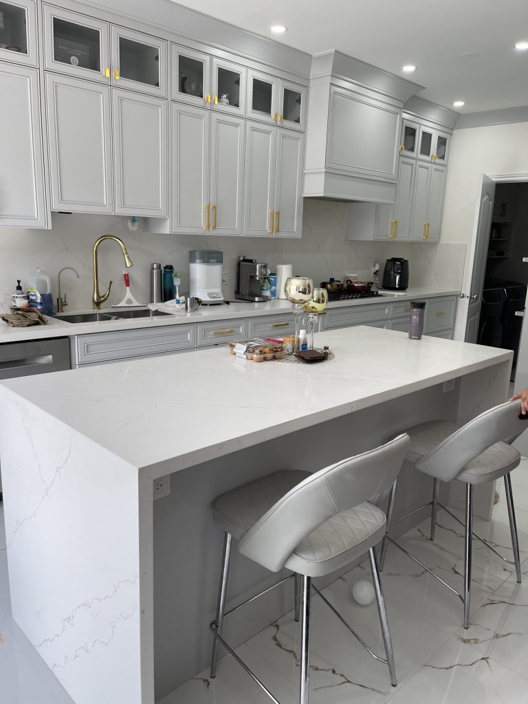 Finished kitchen with hardwood-look flooring — Rouge Home Development Inc., GTA