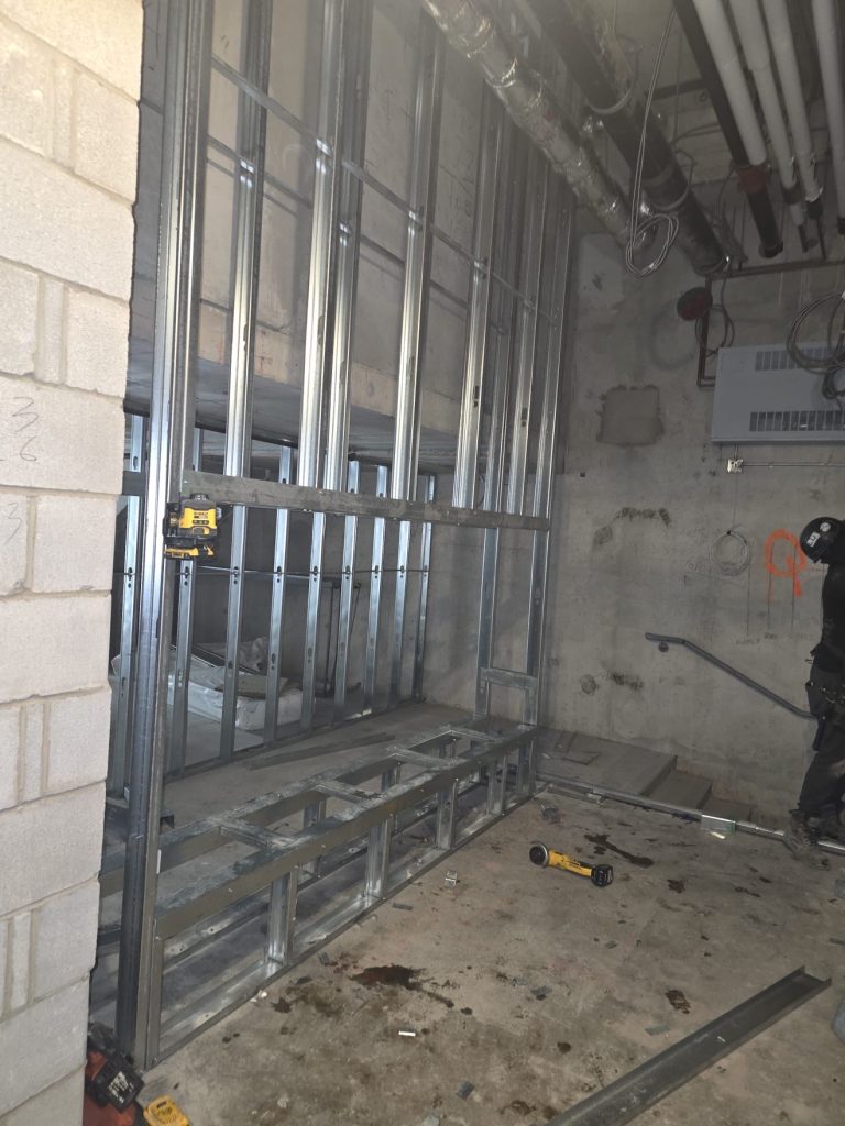 Steel stud wall framing with laser level — Rouge Home Development Inc., GTA
